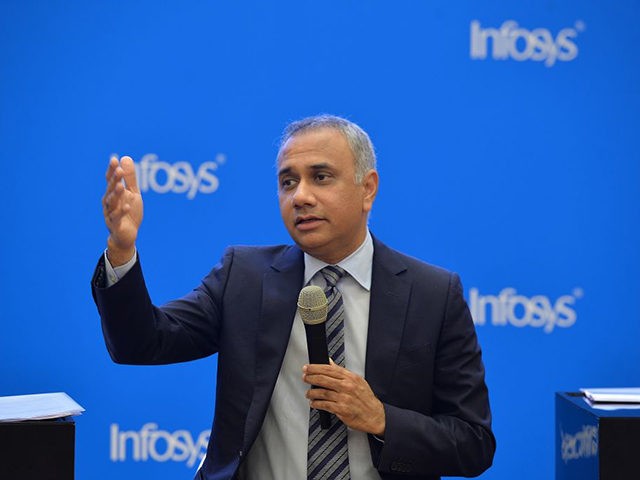 Indian CEO and Managing Director of Infosys Salil Parekh gestures while addressing a press conference held to announce the company's first quarter results in Bangalore on July 13, 2018. (Photo by MANJUNATH KIRAN / AFP) (Photo credit should read MANJUNATH KIRAN/AFP via Getty Images)
