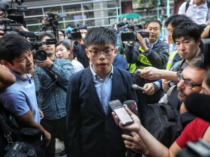 Pro-democracy activist Joshua Wong, who was disqualified from running, arrives to vote in the South Horizons district during local council elections in Hong Kong on November 24, 2019. - Hong Kong voted in district council elections in a ballot the city's pro-democracy movement hoped would send a message to the …