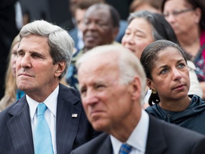 US Secretary of State John Kerry (L), US Vice President Joseph R. Biden (C) and National Security Adviser Susan Rice listen while US President Barack Obama speaks at the Lincoln Memorial on the National Mall August 28, 2013 in Washington, DC. Obama and others spoke to commemorate the 50th anniversary …