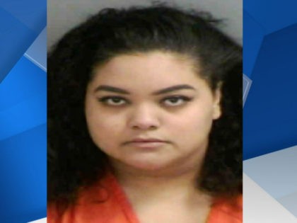 Kirstie None Rosa is a teacher's aide who has been charged with having sex with two 15-year-old students in her condo's community swimming pool.