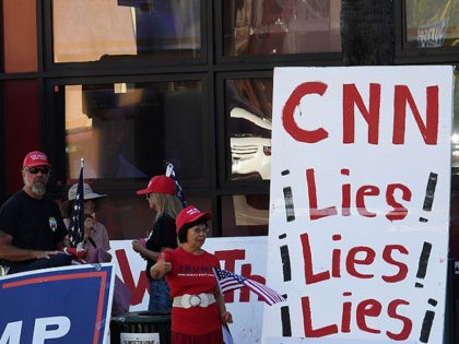 Supporters of Republican presidential hopeful Donald Trump protest against alleged bias outside the CNN offices in Hollywood, California on October 22, 2016. / AFP / Mark RALSTON (Photo credit should read MARK RALSTON/AFP via Getty Images)