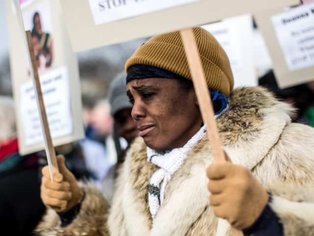 WASHINGTON, DC - JANUARY 26: Movita Johnson-Harrell takes part in a march for stricter gun control laws on January 26, 2013 in Washington, DC. Demonstrators included survivors of the shooting at Virginia Tech, Newtown, Connecticut, and others. (Photo by Brendan Hoffman/Getty Images)