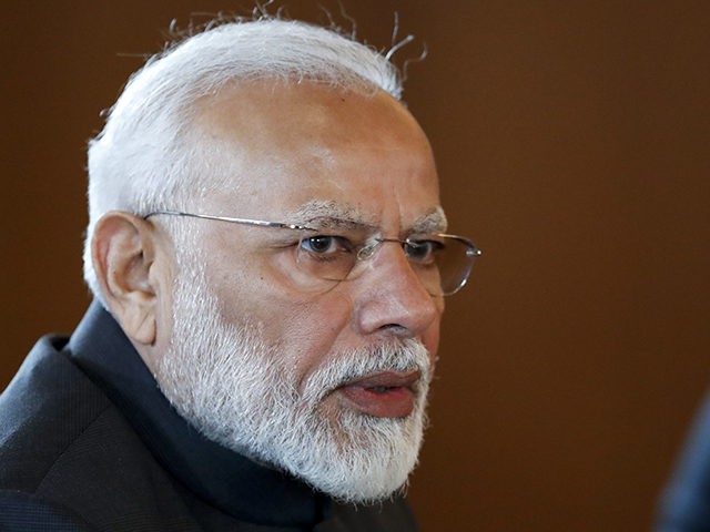 Indian Prime Minister Narendra Modi speaks to Russian President Vladimir Putin during thei