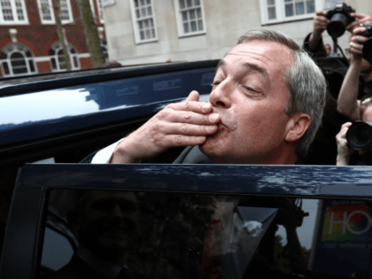 LONDON, ENGLAND - JUNE 07: UKIP leader Nigel Farage blows a kiss to a supporter as he leaves after unveiling a new campaign poster ahead of a televised debate with the Prime Minister later today on June 7, 2016 in London, England. Campaigning continues by all parties ahead of the …
