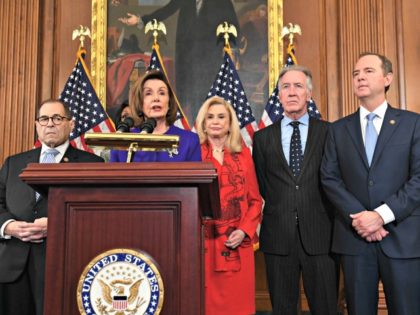 Speaker of the House Nancy Pelosi (C), flanked by House Permanent Select Committee on Inte