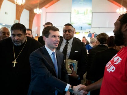 Reverend William Barber walks with South Bend, Indiana mayor and Democratic presidential candidate, Pete Buttigieg, as they leave after Sunday morning service at Greenleaf Christian Church in Goldsboro, North Carolina on December 1, 2019. (Photo by Logan Cyrus / AFP) (Photo by LOGAN CYRUS/AFP via Getty Images)