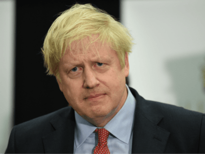 Britain's Prime Minister and Conservative leader Boris Johnson prepares to speak on stage