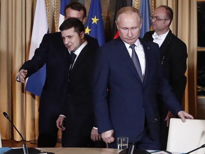 Russian President Vladimir Putin, right, and Ukrainian President Volodymyr Zelenskiy arrive for a working session at the Elysee Palace Monday, Dec. 9, 2019 in Paris. Russian President Vladimir Putin and Ukraine's president are meeting for the first time at a summit in Paris to find a way to end the …