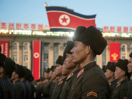 TOPSHOT - North Korean soldiers attend a mass rally to celebrate the North's declaration o