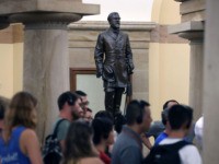 WASHINGTON, DC - AUGUST 17: Tourists walk past the Statue of Confederate General Robert E. Lee that is located inside the US Capitol August 17, 2017 in Washington, DC. House Minority Leader Nancy Pelosi (D-CA) has called for the removal of all Confederate statues from the United States Capitol. (Photo …