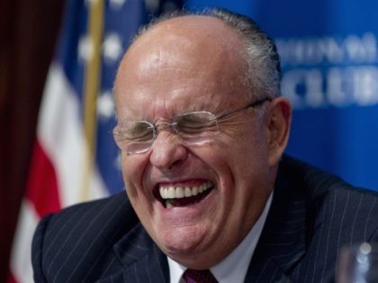Rudy Giuliani laughs (Saul Loeb / AFP / Getty)