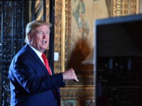 US President Donald Trump answers questions from reporters after making a video call to the troops stationed worldwide at the Mar-a-Lago estate in Palm Beach Florida, on December 24, 2019. (Photo by Nicholas Kamm / AFP) (Photo by NICHOLAS KAMM/AFP via Getty Images)