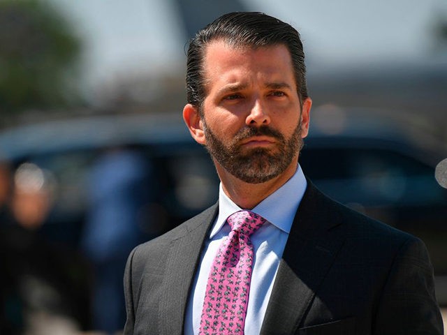 Donald Trump, Jr. looks on upon arrival at General Mitchell International Airport, with US