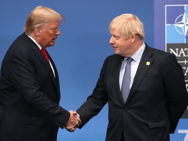 HERTFORD, ENGLAND - DECEMBER 04: British Prime Minister Boris Johnson shakes hands with US President Donald Trump onstage during the annual NATO heads of government summit on December 4, 2019 in Watford, England. France and the UK signed the Treaty of Dunkirk in 1947 in the aftermath of WW2 cementing …