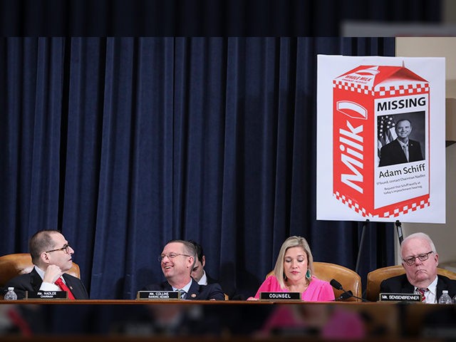 Chairman Rep. Jerrold Nadler (D-NY) looks up at a Republican prop with an image of House Intelligence Committee Chairman Adam Schiff on a milk carton as Republican ranking member Rep. Doug Collins (R-GA) laughs while sitting beside Republican staff counsel Ashley Hurt Callen and Rep. Jim Sensenbrenner (R-WI) during testimony …