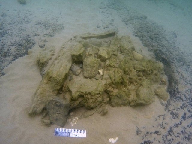 This photo provided by Ehud Galili shows what researchers say is 7,000-year-old-seawall al
