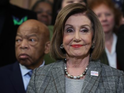 WASHINGTON, DC - DECEMBER 06: House Speaker Nancy Pelosi (D-CA) stands with Rep. John Lewis (D-GA) (L) and other members during a news conference before the House votes on the H.R. 4, The Voting Rights Advancement Act, on December 6, 2019 in Washington, DC. When the president signs the act …