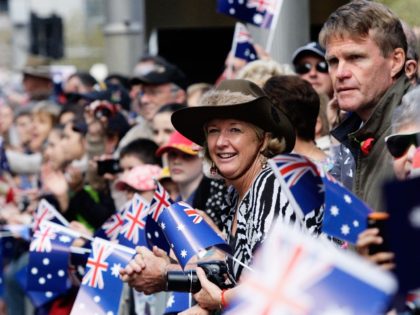 SYDNEY, AUSTRALIA - APRIL 25: Large crowds line George Street and wave Australian flags du