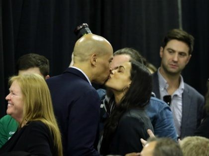CEDAR RAPIDS, IA - NOVEMBER 02: Democratic presidential candidate Sen. Cory Booker (D-NJ) kisses his girlfriend, actress Rosario Dawson, during the Finkenauer Fish Fry at the Hawkeye Downs Event Center on November 02, 2019 in Cedar Rapids, Iowa. The 2020 Iowa Democratic caucuses will take place on February 3, 2020, …