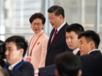 Hong Kong's Chief Executive Carrie Lam and China's President Xi Jinping arrive at the opening ceremony of the Hong Kong-Zhuhai-Macau Bridge at the Zhuhai Port terminal on October 23, 2018. - China's President Xi Jinping launched the world's longest sea bridge connecting Hong Kong, Macau and mainland China on October …