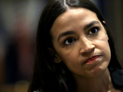 NEW YORK, NY - DECEMBER 14: U.S. Rep. Alexandria Ocasio-Cortez (D-NY) speaks with members