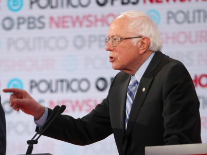 LOS ANGELES, CALIFORNIA - DECEMBER 19: Sen. Bernie Sanders (I-VT) (R) speaks as former Vic