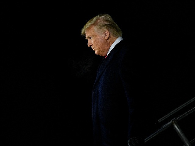 US President Donald Trump arrives at W. K. Kellogg Airport as the US House of Representatives debates his impeachment December 18, 2019, in Battle Creek, Michigan. (Photo by Brendan Smialowski / AFP) (Photo by BRENDAN SMIALOWSKI/AFP via Getty Images)