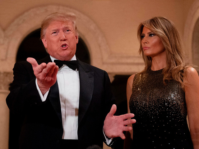 `US President Donald Trump and First Lady Melania Trump speak to the press outside the grand ballroom as they arrive for a New Year's celebration at Mar-a-Lago in Palm Beach, Florida, on December 31, 2019. (Photo by JIM WATSON / AFP) (Photo by JIM WATSON/AFP via Getty Images)