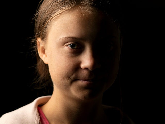 Teen activist Greta Thunberg poses for a picture after an interview ahead of the Global Cl