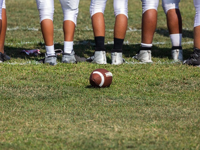 Football placed on field – Players getting ready for the game