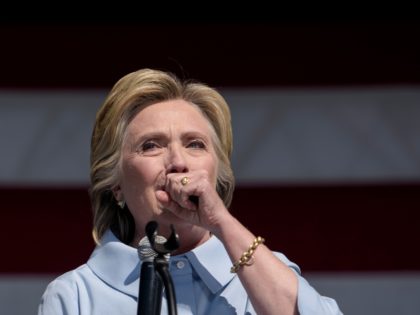 Democratic presidential nominee Hillary Clinton coughs during a Labor Day rally September 5, 2016 in Cleveland, Ohio. Hillary Clinton launched the home stretch of her US presidential bid aiming to solidify her advantages over rival Donald Trump, with both candidates converging on working-class Ohio as ground zero of their 2016 …
