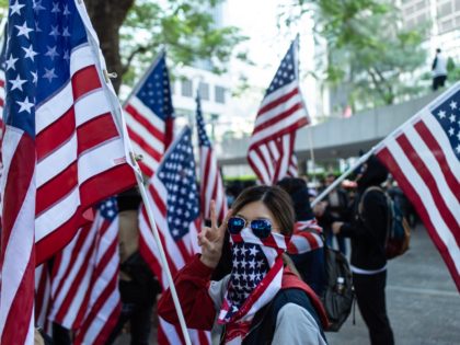 People take part in a march from Chater Garden to the US Consulate in Hong Kong on Decembe