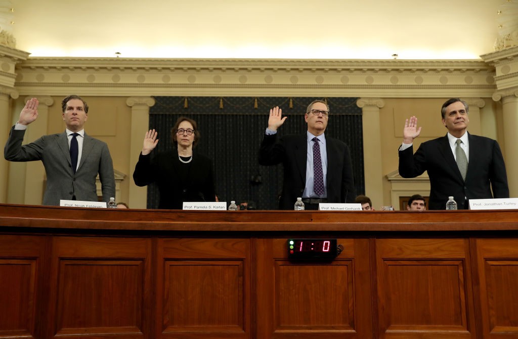 WASHINGTON, DC – DECEMBER 4: Constitutional scholars Noah Feldman of Harvard University, Pamela Karlan of Stanford University, Michael Gerhardt of the University of North Carolina, and Jonathan Turley of George Washington University are sworn in to testify before the House Judiciary Committee in the Longworth House Office Building on Capitol Hill December 4, 2019 in Washington, DC. This is the first hearing held by the Judiciary Committee in the impeachment inquiry against U.S. President Donald Trump, whom House Democrats say held back military aid for Ukraine while demanding it investigate his political rivals. The Judiciary Committee will decide whether to draft official articles of impeachment against President Trump to be voted on by the full House of Representatives. (Photo by Chip Somodevilla/Getty Images)