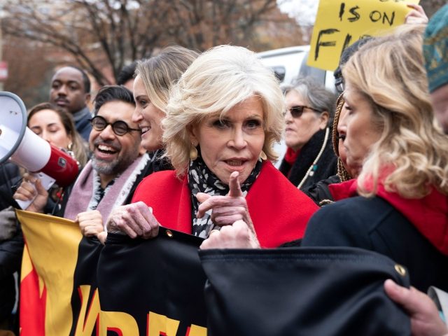 Actress Jane Fonda (C) joins a rally to protest against climate change in Washington, DC, on December 6, 2019. (Photo by JIM WATSON / AFP) (Photo by JIM WATSON/AFP via Getty Images)