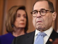 House Judiciary Chairman Jerry Nadler (D-NY), flanked by Speaker of the House Nancy Pelosi, reacts as Democrats announced articles of impeachment against US President Donald Trump during a press conference at the US Capitol in Washington, DC, December 10, 2019 listing abuse of power and obstruction of Congress. (Photo by …