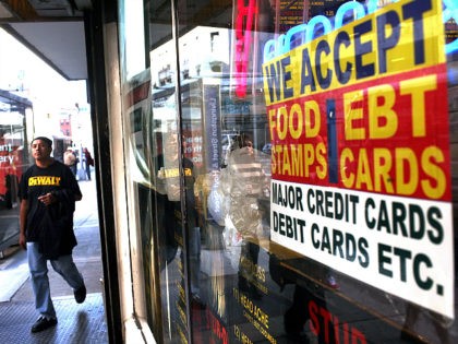 NEW YORK - OCTOBER 07: A sign in a market window advertises the acceptance of food stamps