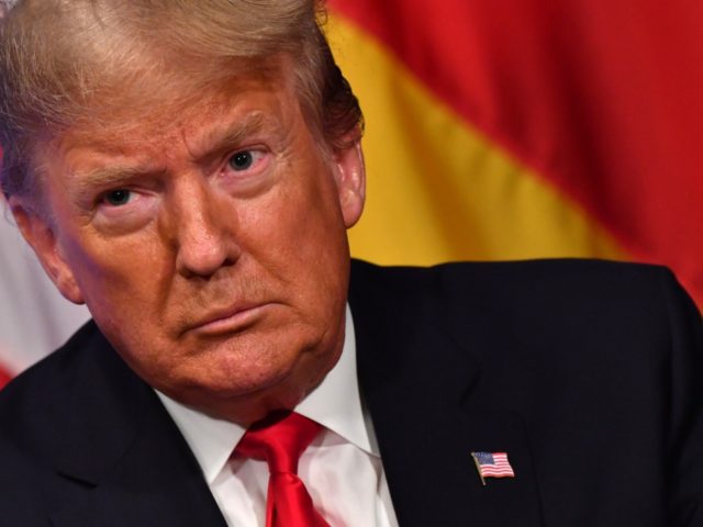 US President Donald Trump looks on during a bilateral meeting with German Chancellor Angel