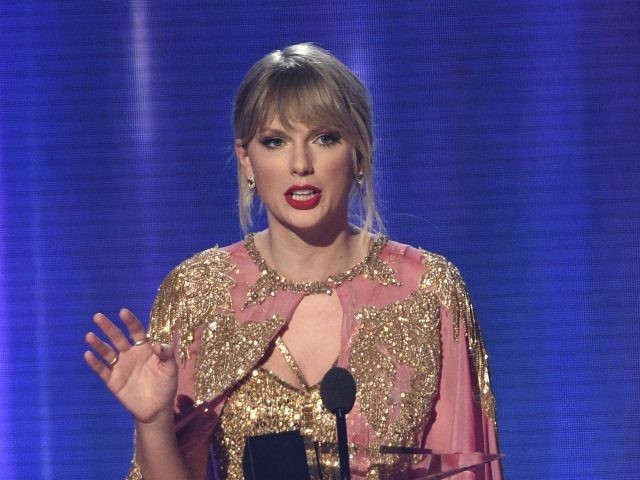Taylor Swift accepts the award for artist of the year at the American Music Awards on Sunday, Nov. 24, 2019, at the Microsoft Theater in Los Angeles. (Photo by Chris Pizzello/Invision/AP)