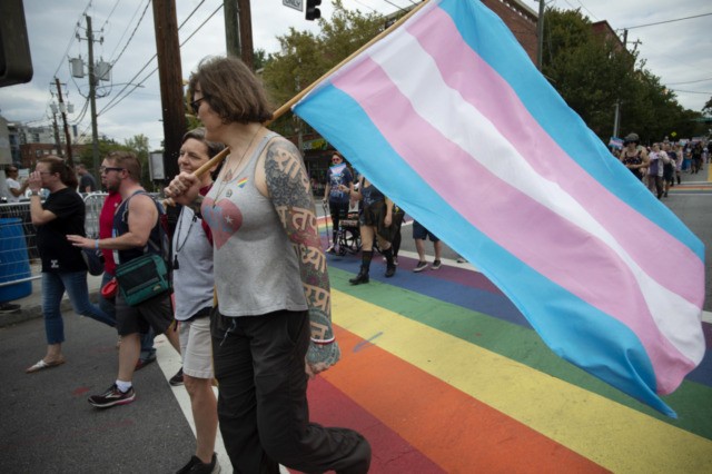 Members of Georgia's transgender and non-binary community stroll through the city's Midtown district during Gay Pride Festival's Transgender Rights March in Atlanta on Saturday, Oct. 12, 2019. (AP Photo/Robin Rayne)