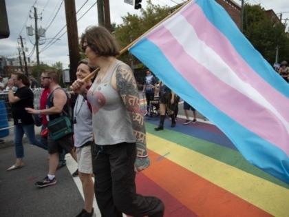 Members of Georgia's transgender and non-binary community stroll through the city's Midtown district during Gay Pride Festival's Transgender Rights March in Atlanta on Saturday, Oct. 12, 2019. (AP Photo/Robin Rayne)