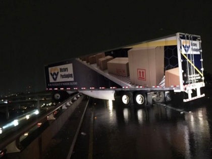 truck hanging off bridge