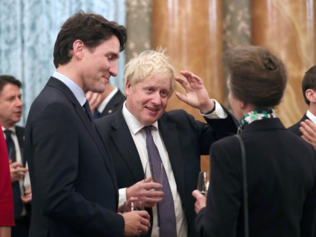 LONDON, ENGLAND - DECEMBER 03: Princess Anne, Princess Royal talks to Prime Minister Boris