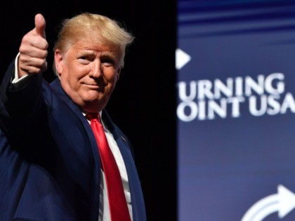 TOPSHOT - US President Donald Trump gestures during the Turning Point USA Student Action S