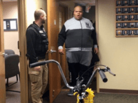 A stunned Ty Burch walks into the River Falls, Wisconsin police station where he is surprised to find a new bike.