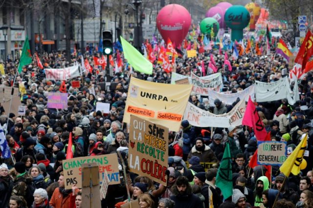 Hundreds of thousands march as France paralysed by strike