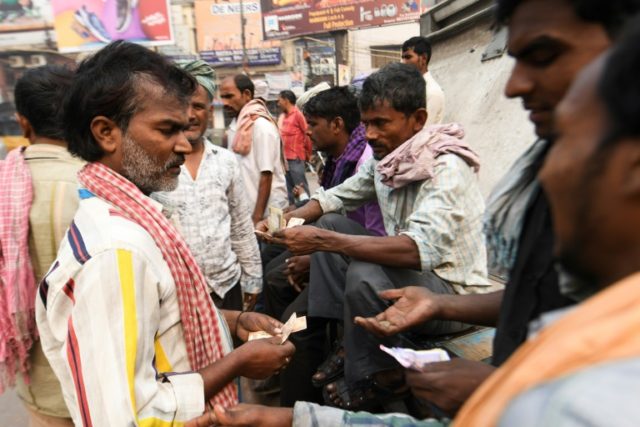 India's poor fight desperate battle to find work as slowdown bites