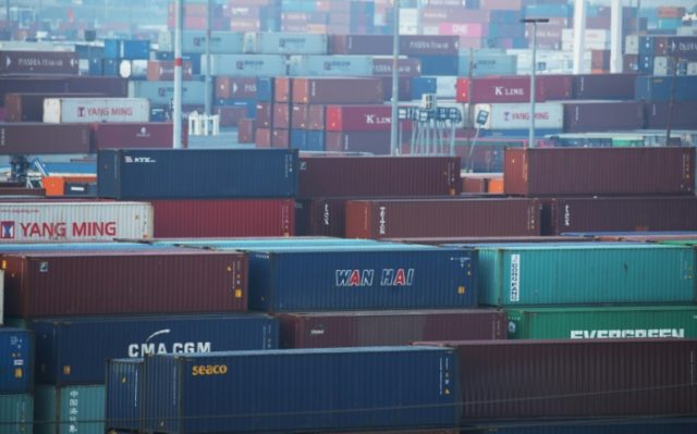 Asian markets mostly down as traders eye tariffs deadline