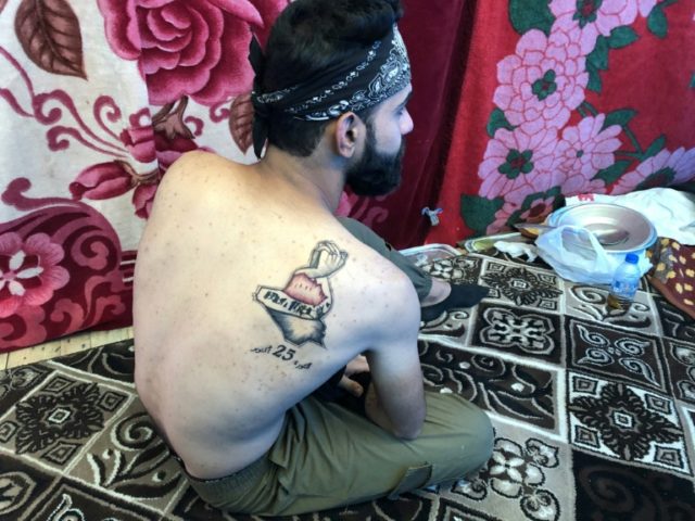 Inked at the uprising: Iraq's teenage tattoo artist