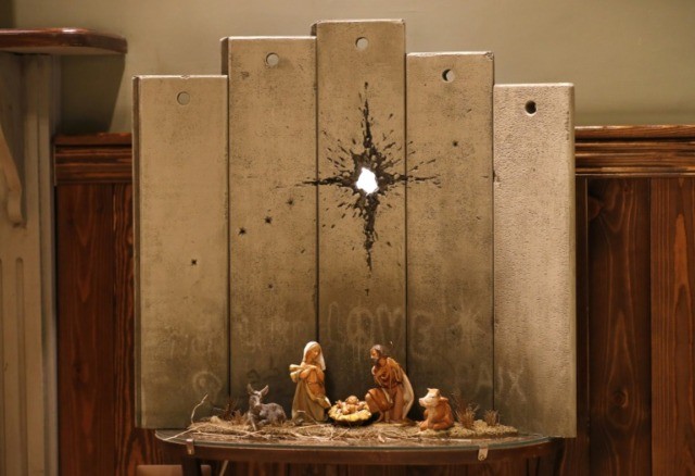 Mysterious artist Banksy unveils dark nativity in Bethlehem