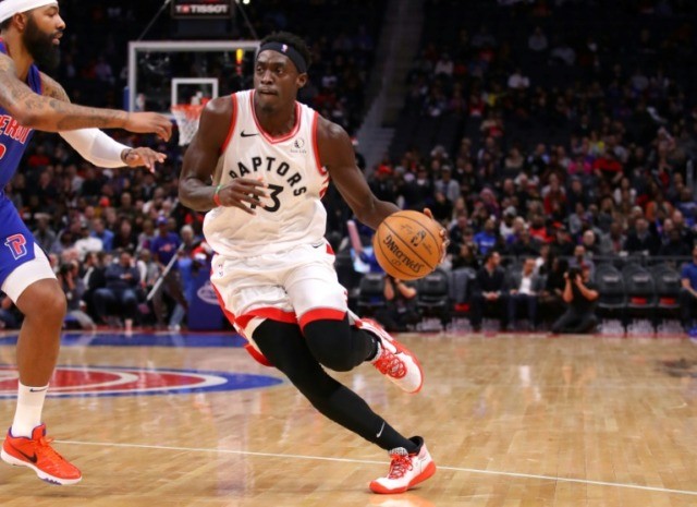 Holiday shines as Pacers edge Raptors in overtime